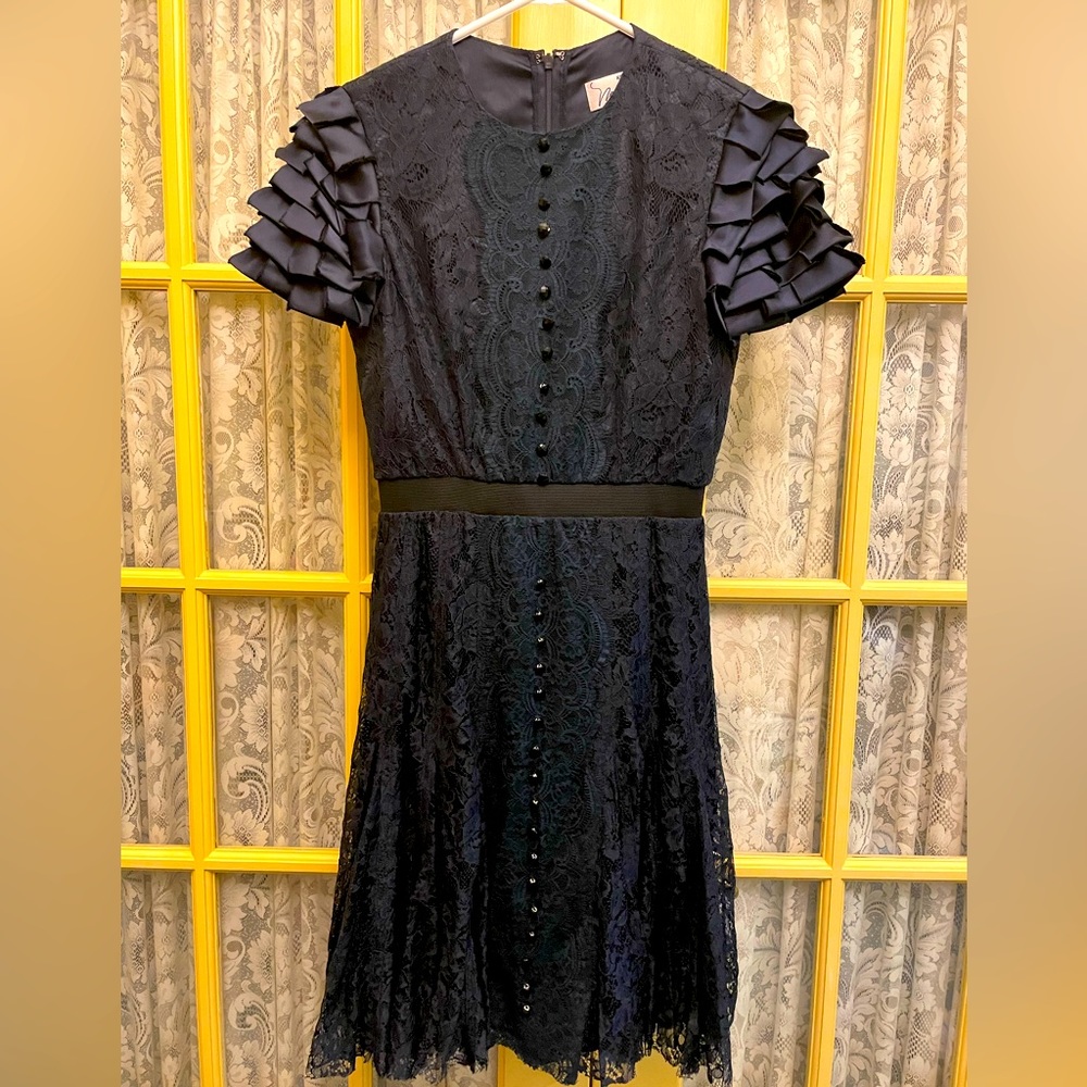 Size 8 Miri navy lace dress with fun layered short sleeves. Flattering waist.